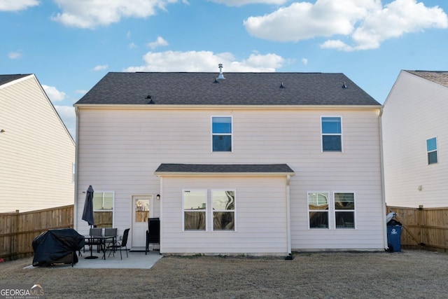 back of property with a patio area