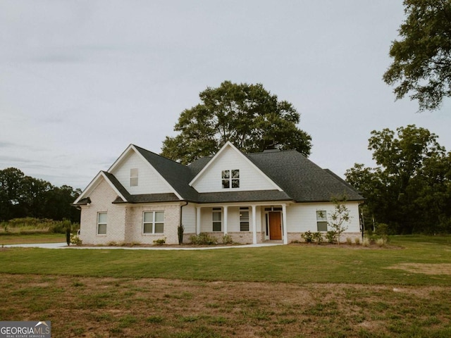 view of front of house featuring a porch and a front yard