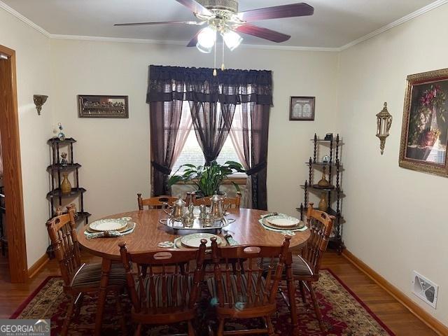 dining area featuring hardwood / wood-style flooring, ceiling fan, and ornamental molding