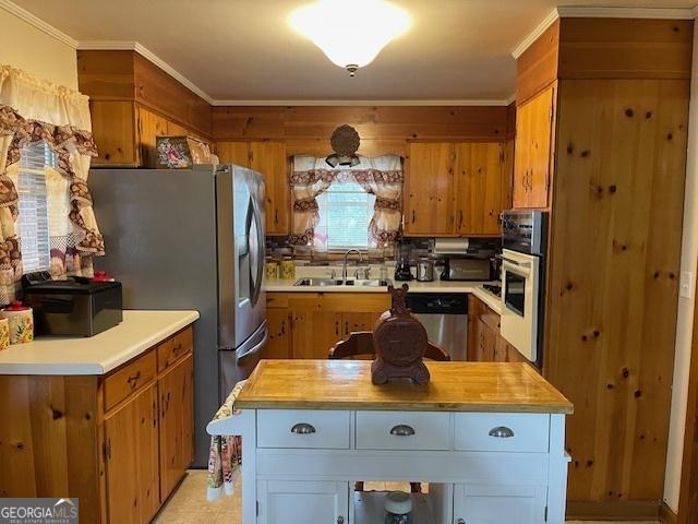 kitchen featuring sink, white cabinetry, appliances with stainless steel finishes, and wood counters