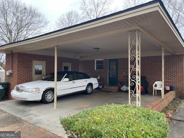 view of car parking with a carport