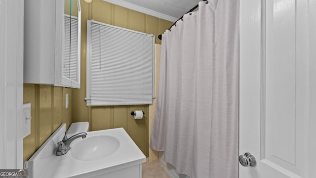 bathroom with vanity and ornamental molding