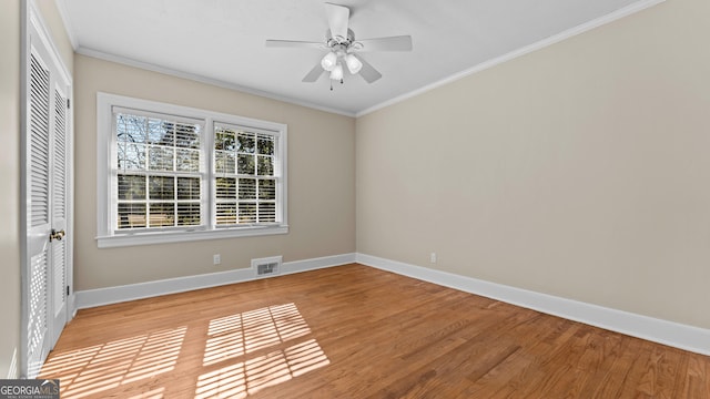 unfurnished room featuring crown molding, ceiling fan, and light hardwood / wood-style floors