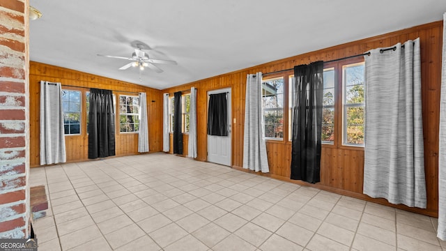 interior space with ceiling fan and a healthy amount of sunlight