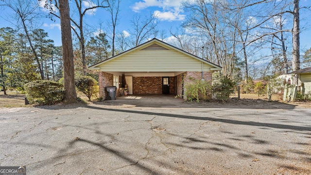 view of side of property featuring a carport