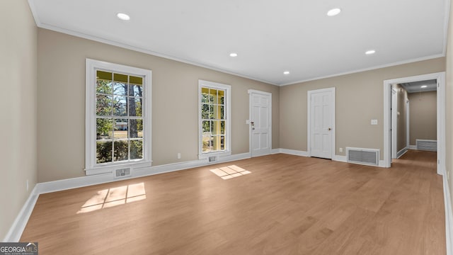 unfurnished room with light hardwood / wood-style flooring and ornamental molding