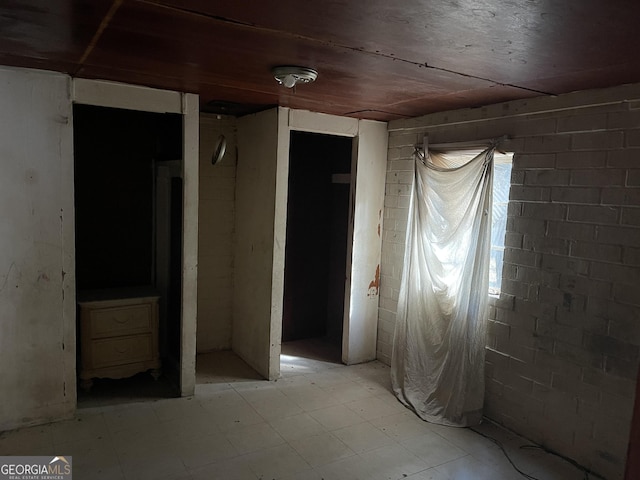 empty room featuring wood ceiling