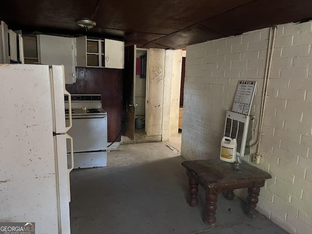 basement featuring white fridge