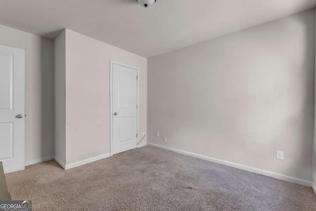 unfurnished bedroom with light carpet