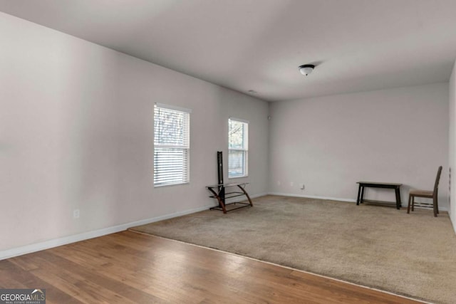 unfurnished room featuring hardwood / wood-style floors