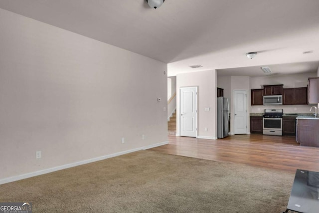 unfurnished living room with carpet floors