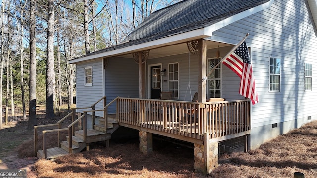 back of property with covered porch