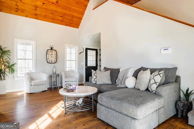 living room with dark hardwood / wood-style floors, high vaulted ceiling, and wooden ceiling