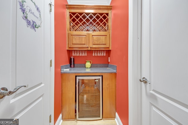 bar with ornamental molding and beverage cooler