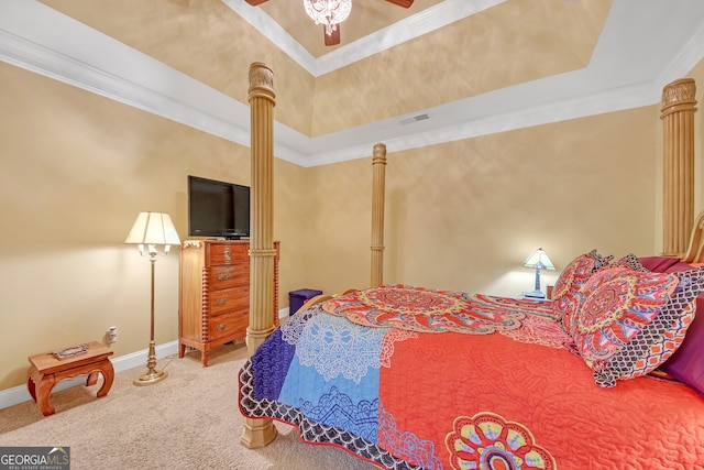 bedroom with ceiling fan, carpet, ornamental molding, and a tray ceiling