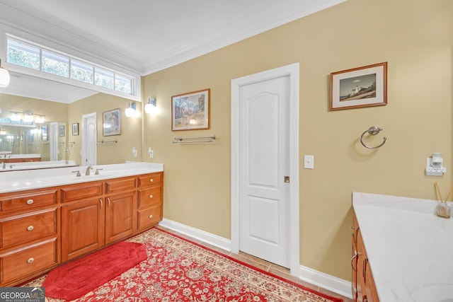 bathroom with vanity, crown molding, and tile patterned flooring