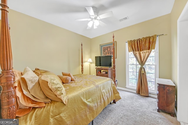 bedroom featuring light colored carpet and ceiling fan