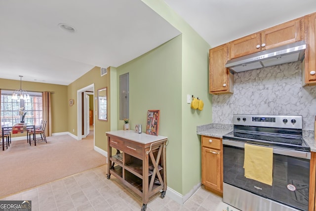 kitchen with light carpet, hanging light fixtures, light stone countertops, electric stove, and a notable chandelier