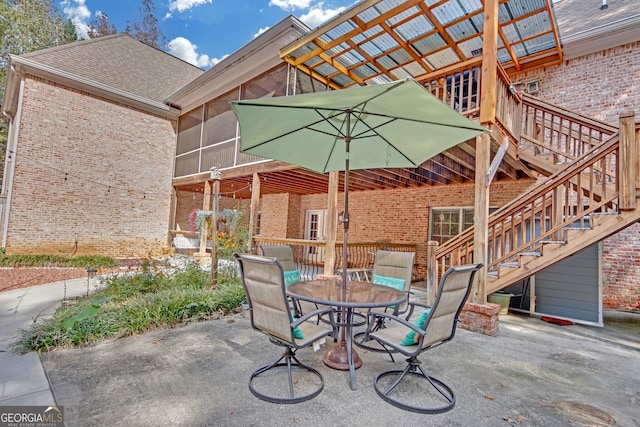 view of patio / terrace with a sunroom