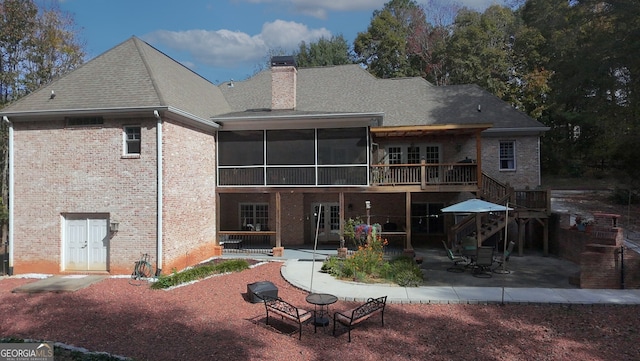 back of house with a sunroom and a patio area