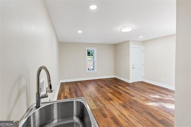 kitchen featuring hardwood / wood-style floors and sink