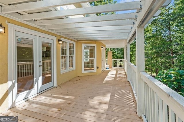 unfurnished sunroom with french doors