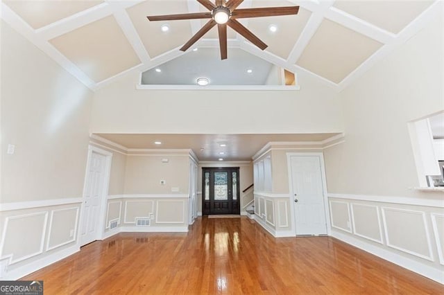 unfurnished living room with french doors, light hardwood / wood-style floors, ceiling fan, and ornamental molding