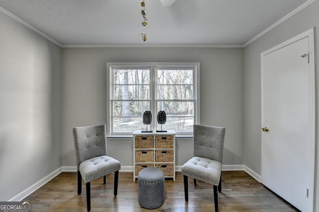 living area with hardwood / wood-style flooring, ornamental molding, and a healthy amount of sunlight