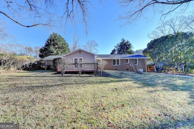 exterior space with a yard and a deck