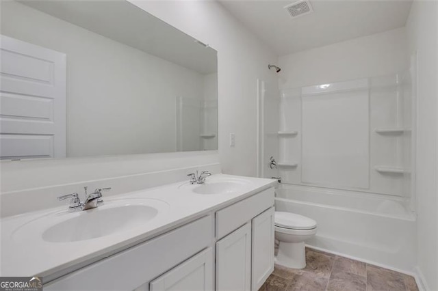 full bathroom with vanity, shower / bath combination, and toilet