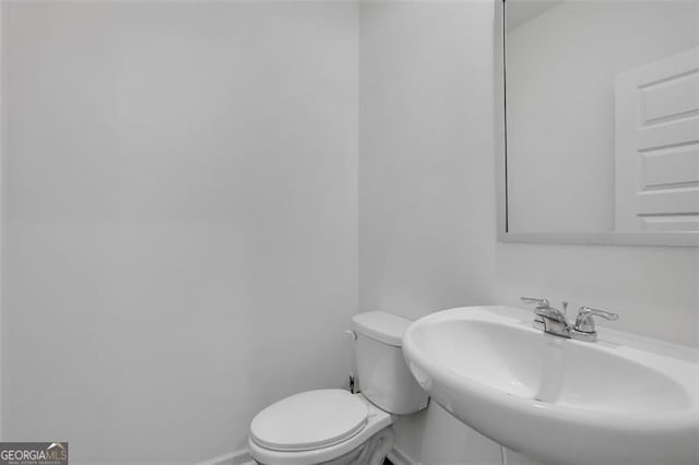 bathroom with toilet and sink