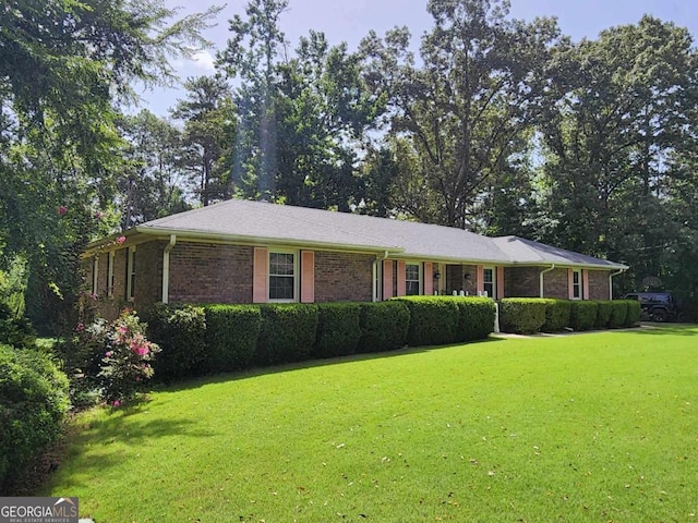 ranch-style house with a front lawn