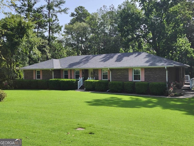 ranch-style house with a front yard