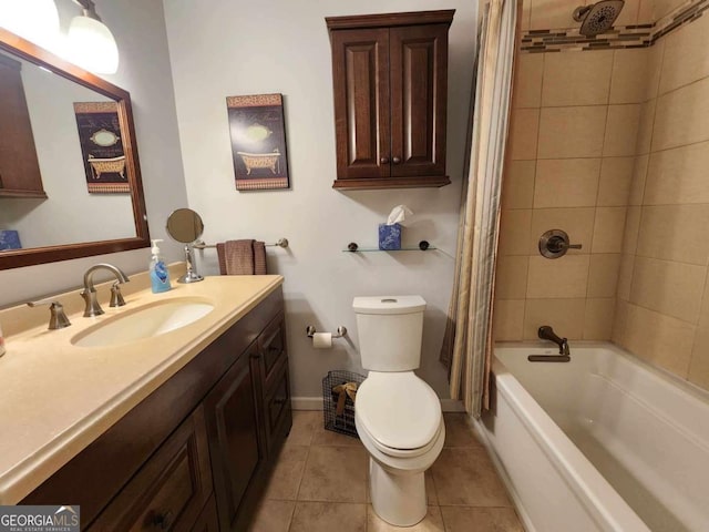 full bathroom with tile patterned floors, shower / bath combo with shower curtain, vanity, and toilet