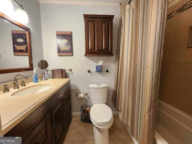 bathroom with tile patterned flooring, vanity, and toilet