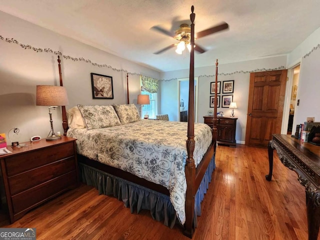 bedroom featuring ceiling fan and wood-type flooring