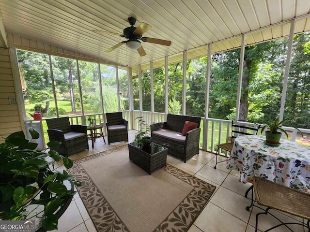 sunroom / solarium with ceiling fan