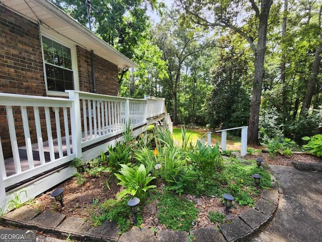 view of yard featuring a wooden deck