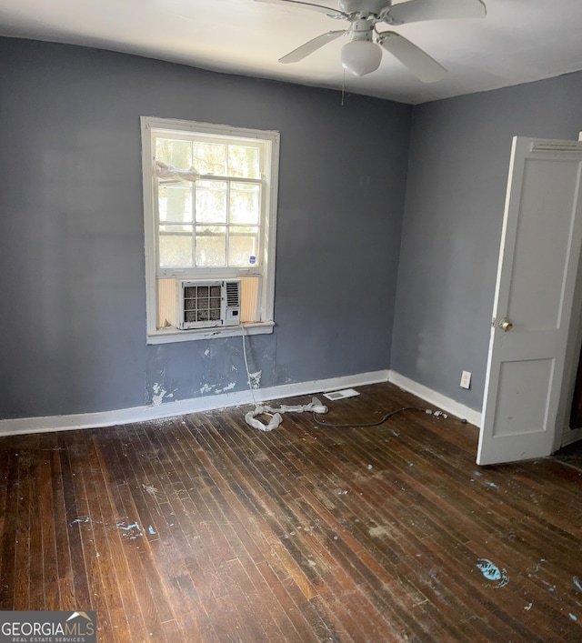 empty room with ceiling fan, cooling unit, and dark hardwood / wood-style floors