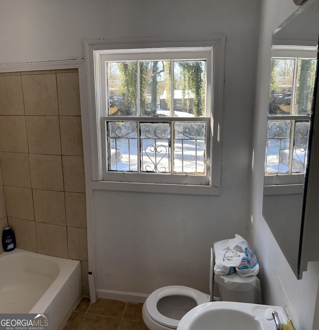 bathroom with sink, tile patterned flooring, and toilet