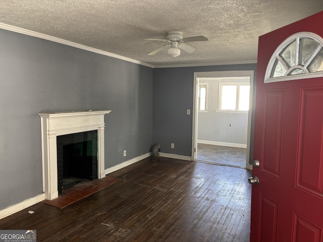 unfurnished living room with dark hardwood / wood-style flooring, a textured ceiling, ceiling fan, and crown molding