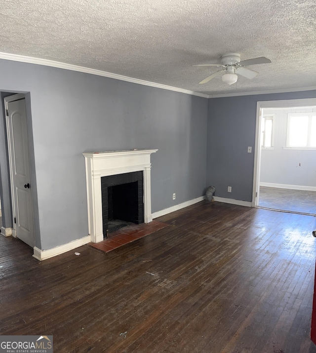 unfurnished living room with a fireplace, ceiling fan, dark hardwood / wood-style floors, and ornamental molding