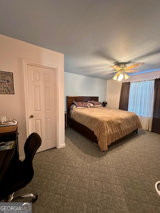 bedroom featuring ceiling fan and carpet flooring