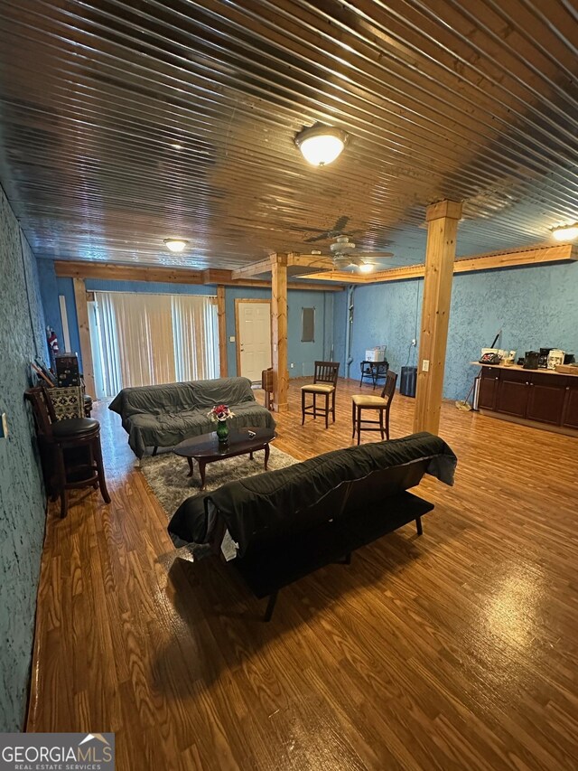 living room with wood-type flooring, ceiling fan, and wood ceiling