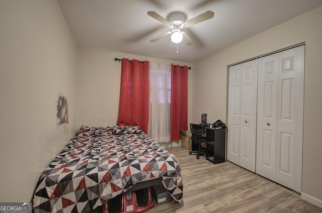 bedroom with a closet, a ceiling fan, and wood finished floors