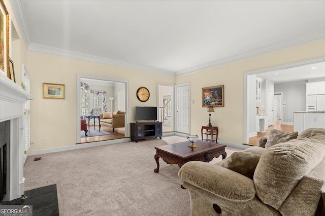 carpeted living room featuring a premium fireplace and crown molding