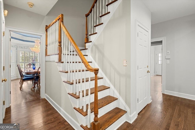 stairway featuring hardwood / wood-style flooring