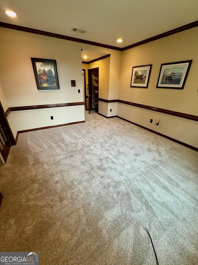 carpeted empty room with ornamental molding