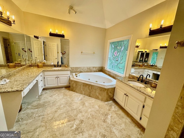 bathroom featuring shower with separate bathtub, vanity, and vaulted ceiling