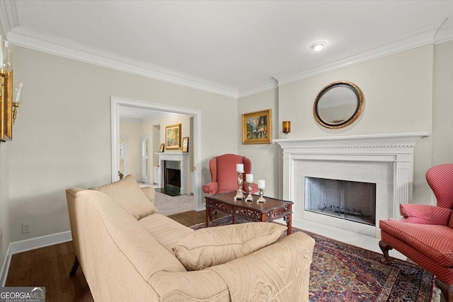 living room with wood-type flooring and ornamental molding